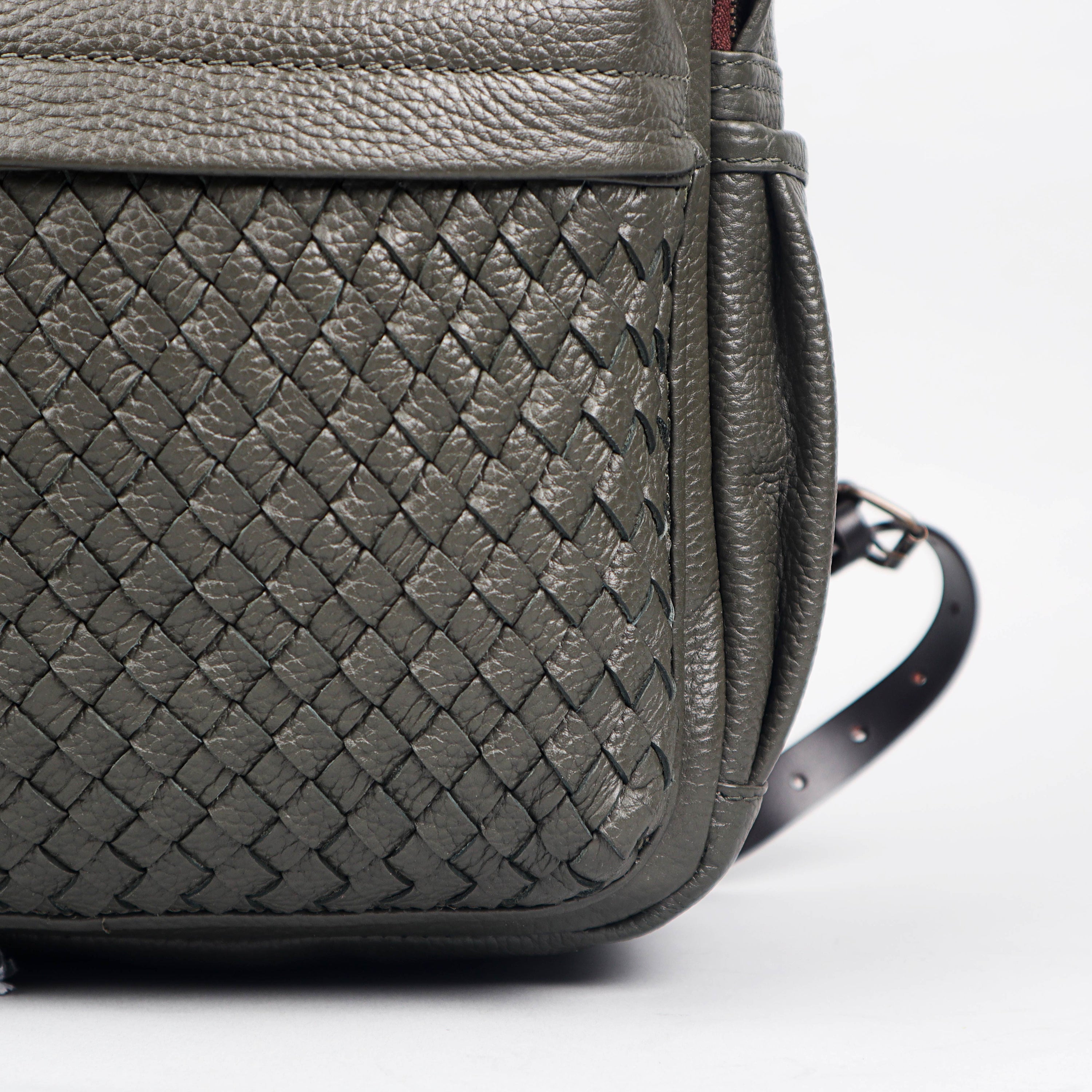 Weaved Journey Leather Backpack showcasing premium full grain leather, multiple pockets, and adjustable straps.