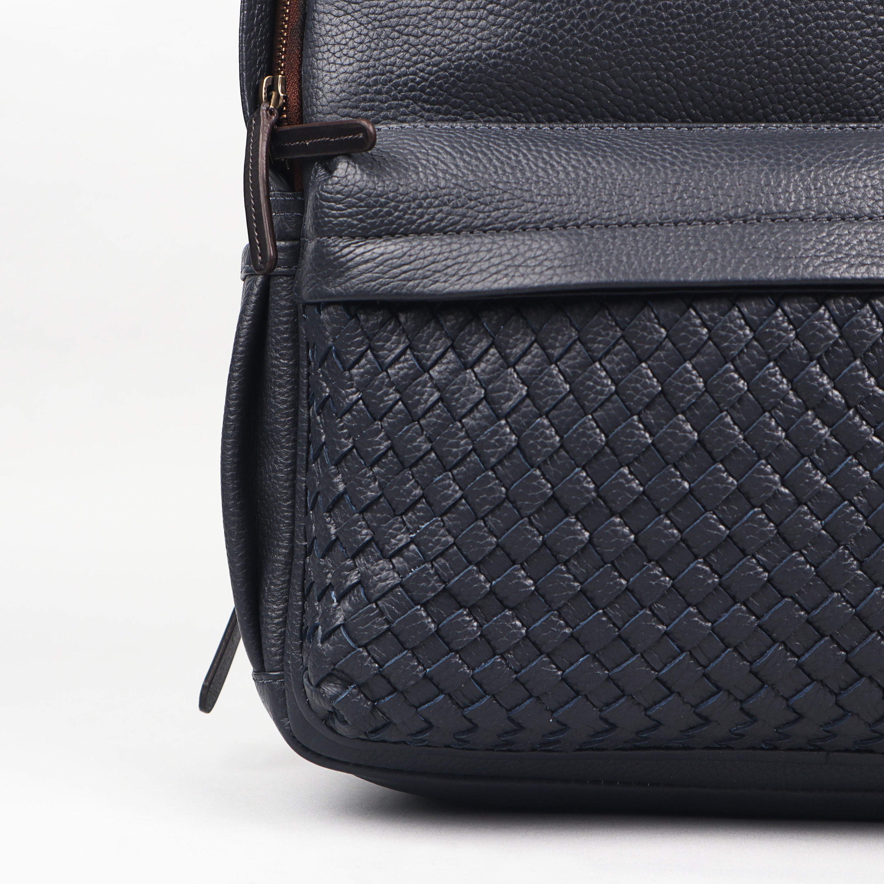 Weaved Journey Leather Backpack showcasing premium full grain leather, multiple pockets, and adjustable straps.