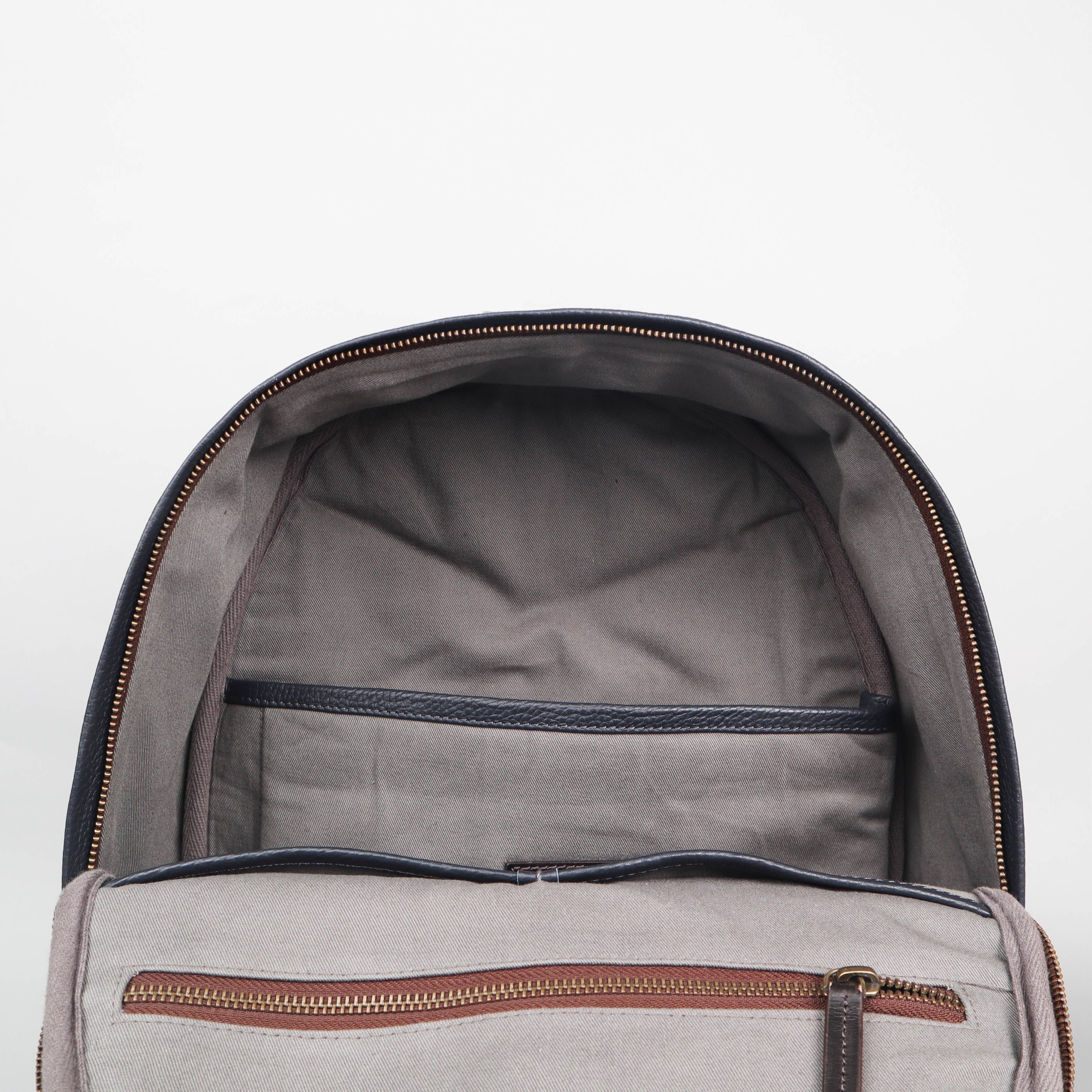 Weaved Journey Leather Backpack showcasing premium full grain leather, multiple pockets, and adjustable straps.