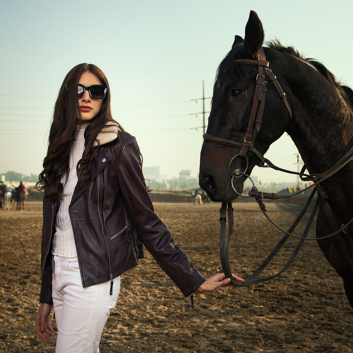 WOMEN PREMIUM MUKMAL Official Leather Jacket showcasing genuine leather, satin lining, and stylish motorcycle design.