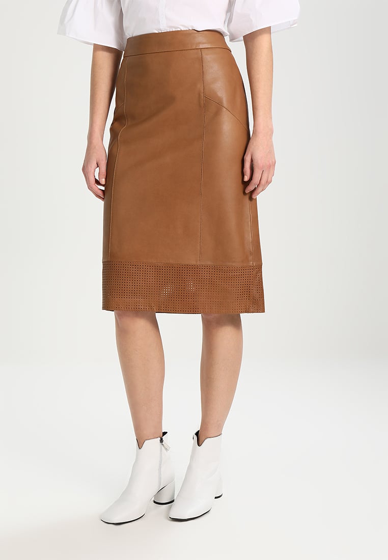 Women Real Lambskin Leather Slim Fit Skirt in knee-length pencil style with satin lining and functional pockets.