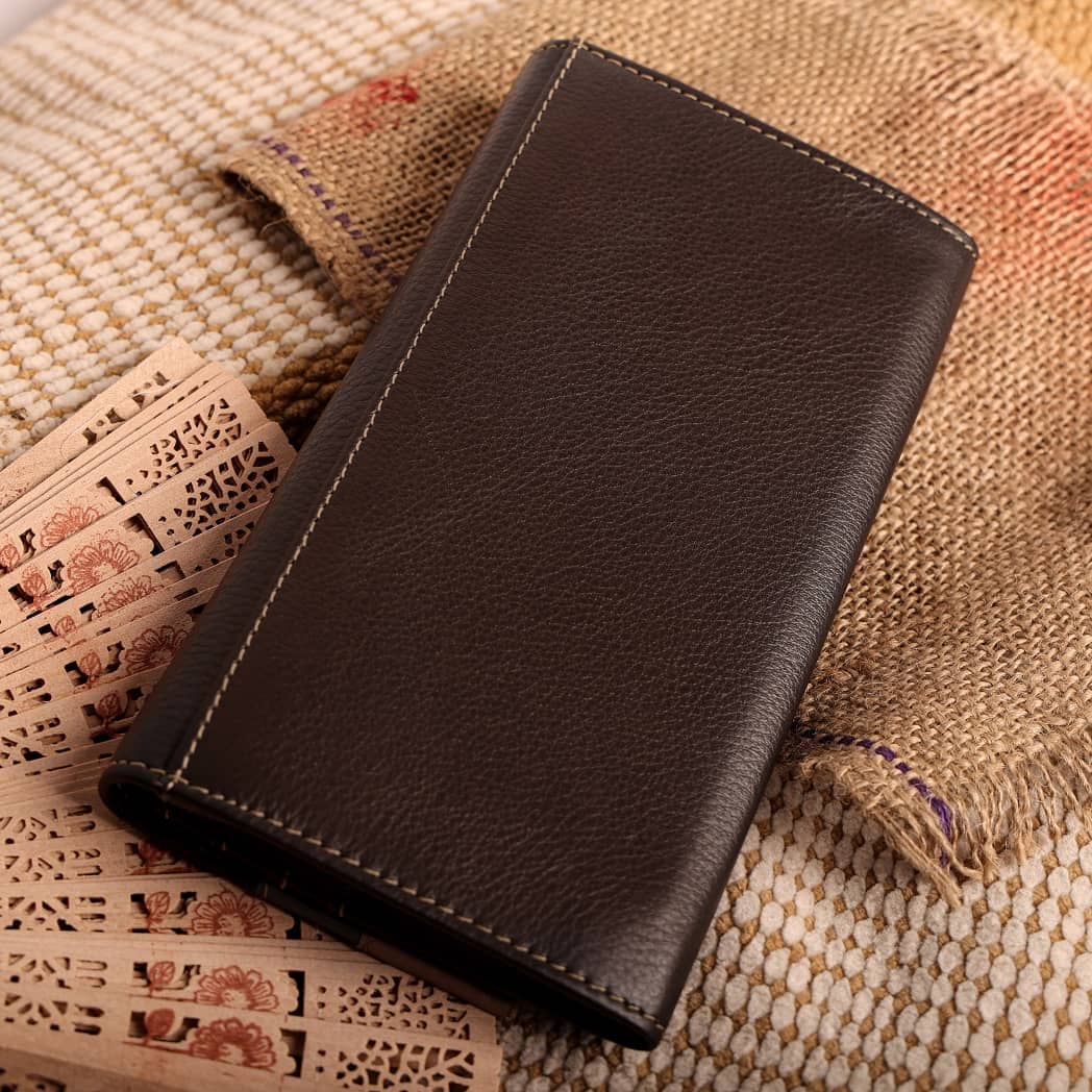 Women vintage wallet made of genuine leather in black and brown colors, showcasing its elegant design and multiple compartments.