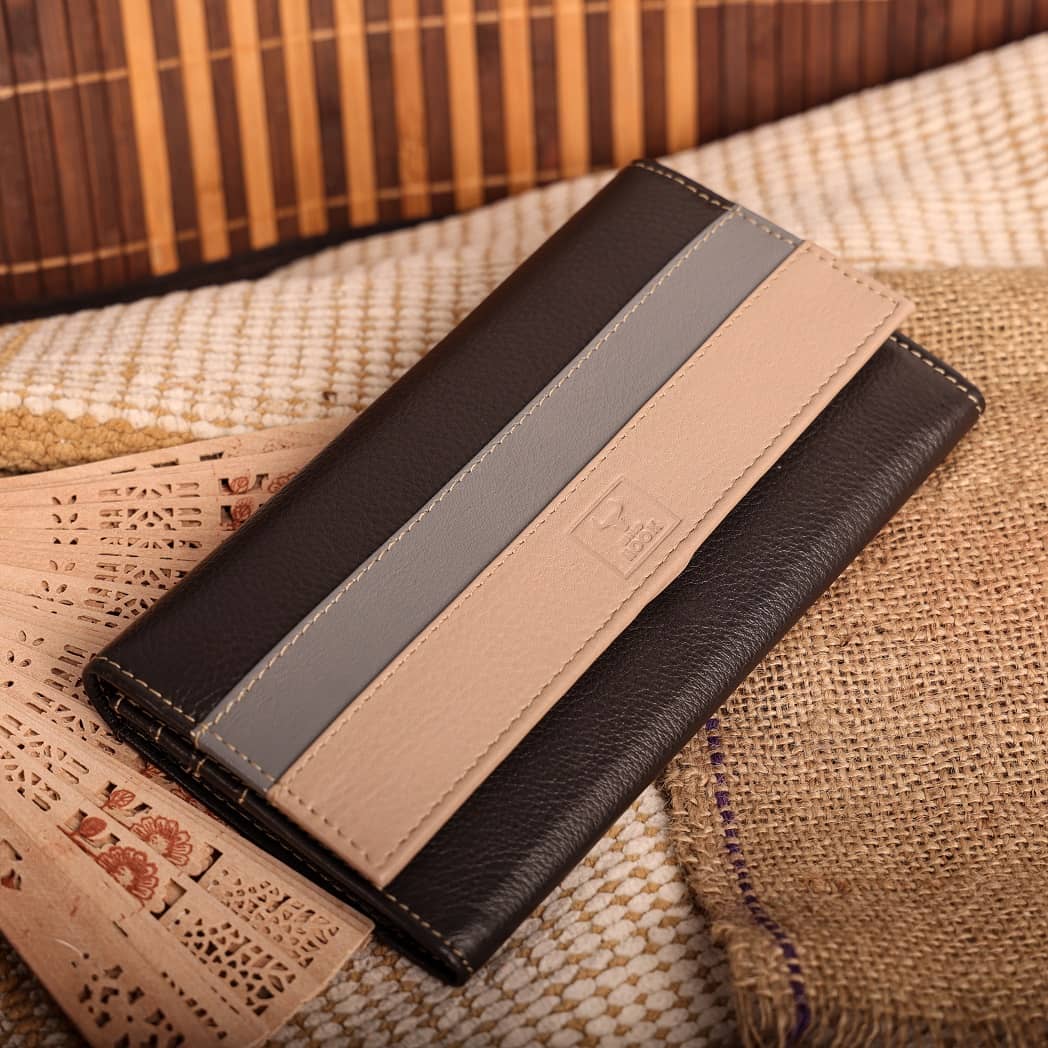 Women vintage wallet made of genuine leather in black and brown colors, showcasing its elegant design and multiple compartments.