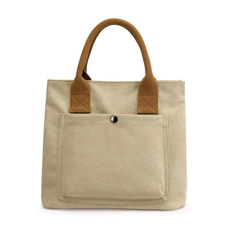 A stylish Women's Casual Canvas Cloth Fashion Handbag in various colors including white, khaki, black, brown, and gray, showcasing its soft surface and compact design.