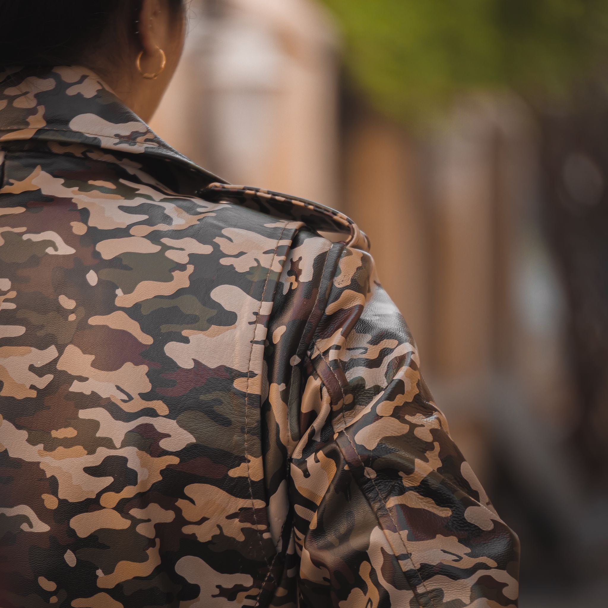 Womens Leather Military Camouflage Print Jacket featuring a stylish camouflage design, lapel collar, and asymmetrical zipper closure.