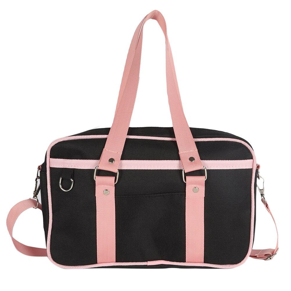 A stylish Women's Contrast Color Canvas Messenger Bag in blue, pink, and black, showcasing its adjustable strap and zipper closure.