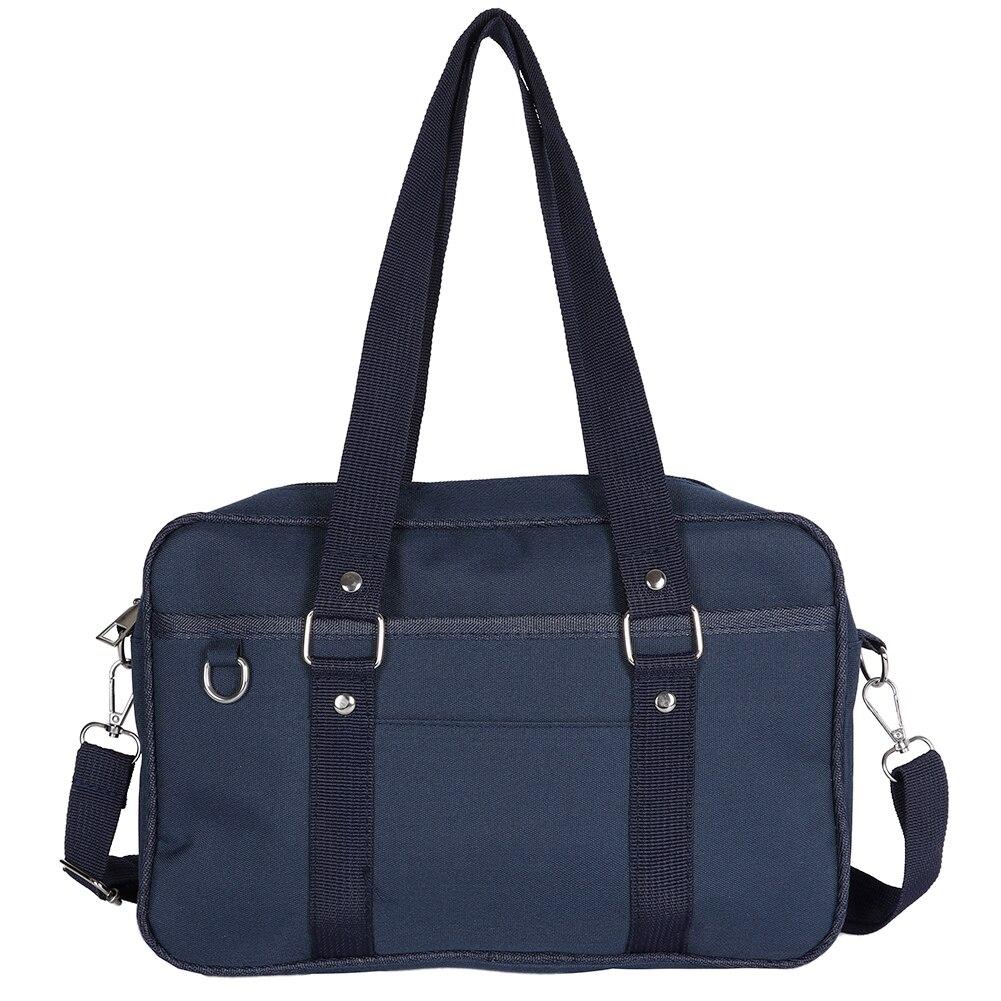 A stylish Women's Contrast Color Canvas Messenger Bag in blue, pink, and black, showcasing its adjustable strap and zipper closure.