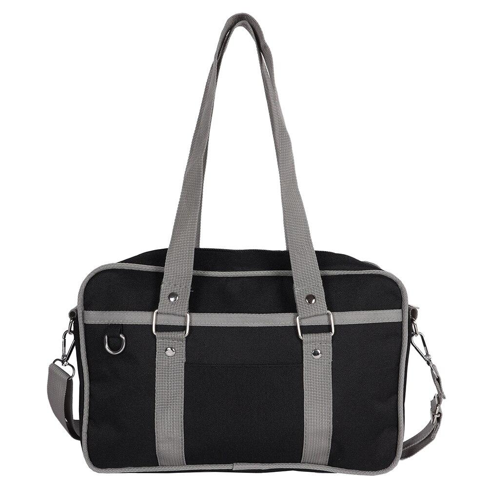 A stylish Women's Contrast Color Canvas Messenger Bag in blue, pink, and black, showcasing its adjustable strap and zipper closure.