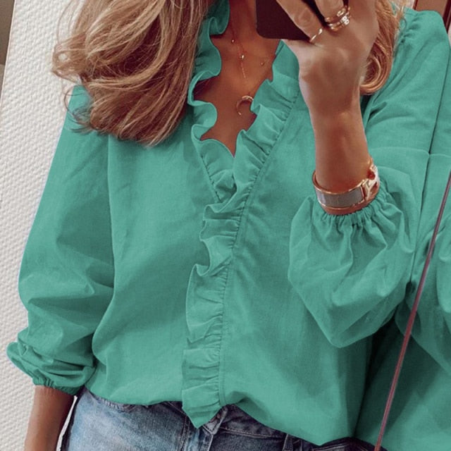 A stylish Women's Ruffle Blouse featuring elegant ruffles, V-neck collar, and full-length sleeves, made from high-quality polyester.