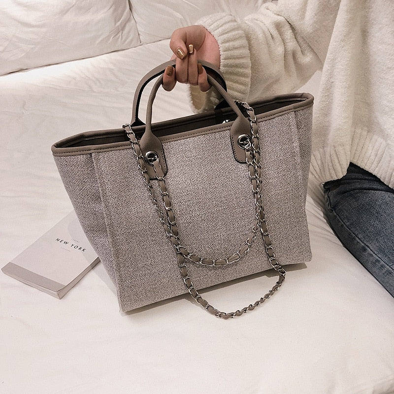 A stylish Women's Simple Canvas Handbag in a neutral color, featuring durable fabric, spacious interior, and comfortable straps, ideal for daily use.