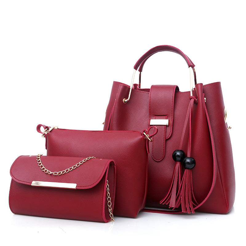 A stylish Women's Three-Piece Handbag set featuring three bags in a horizontal square shape with trendy tassel accents, made from durable PU material.