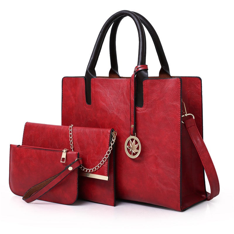 A stylish three-piece set of women's leisure fashion handbags in various sizes, showcasing a modern design with PU fabric and polyester lining.