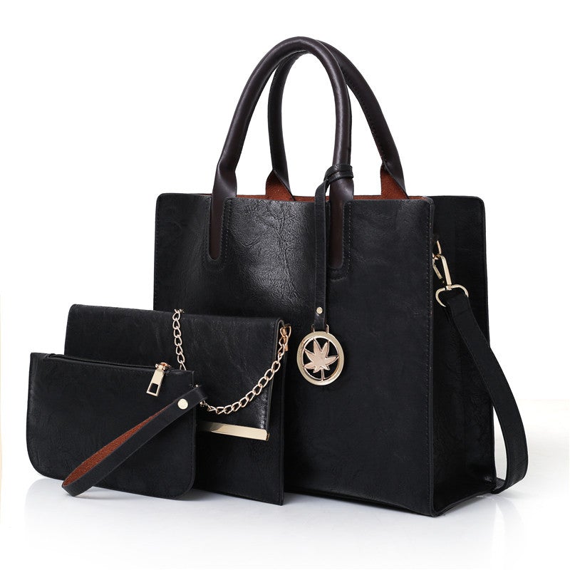 A stylish three-piece set of women's leisure fashion handbags in various sizes, showcasing a modern design with PU fabric and polyester lining.