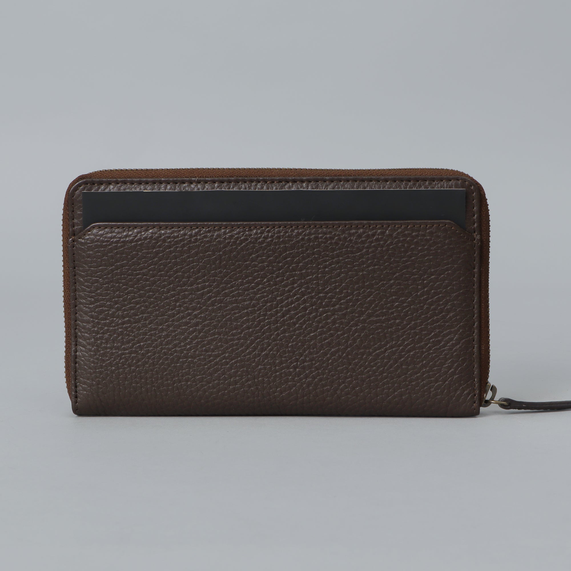 A premium leather World Traveller Wallet showcasing its multiple card pockets, passport compartment, and zipper section for coins.