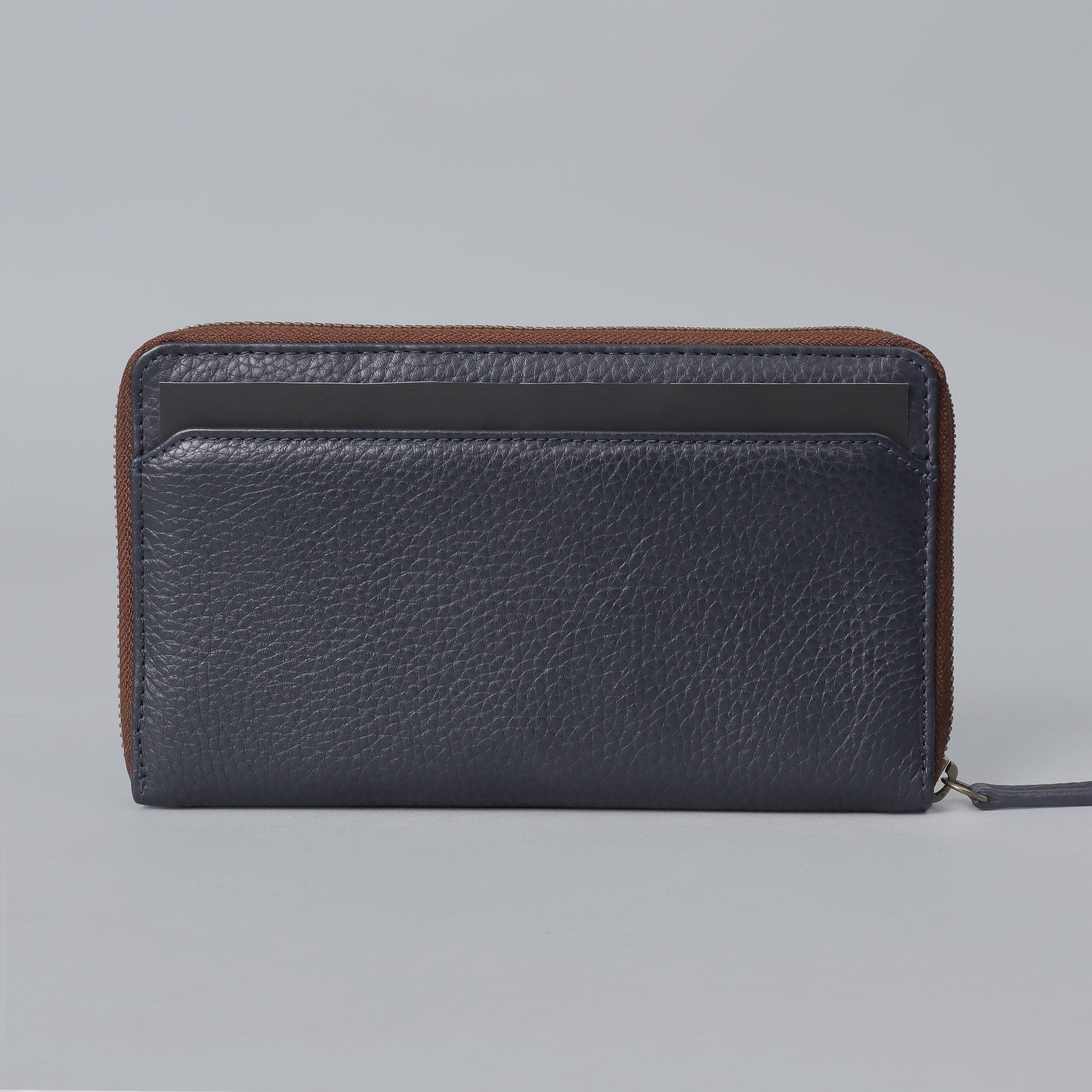 World Traveller Wallet made of premium full grain leather, featuring multiple card pockets, a passport pocket, and a zipper section for coins.