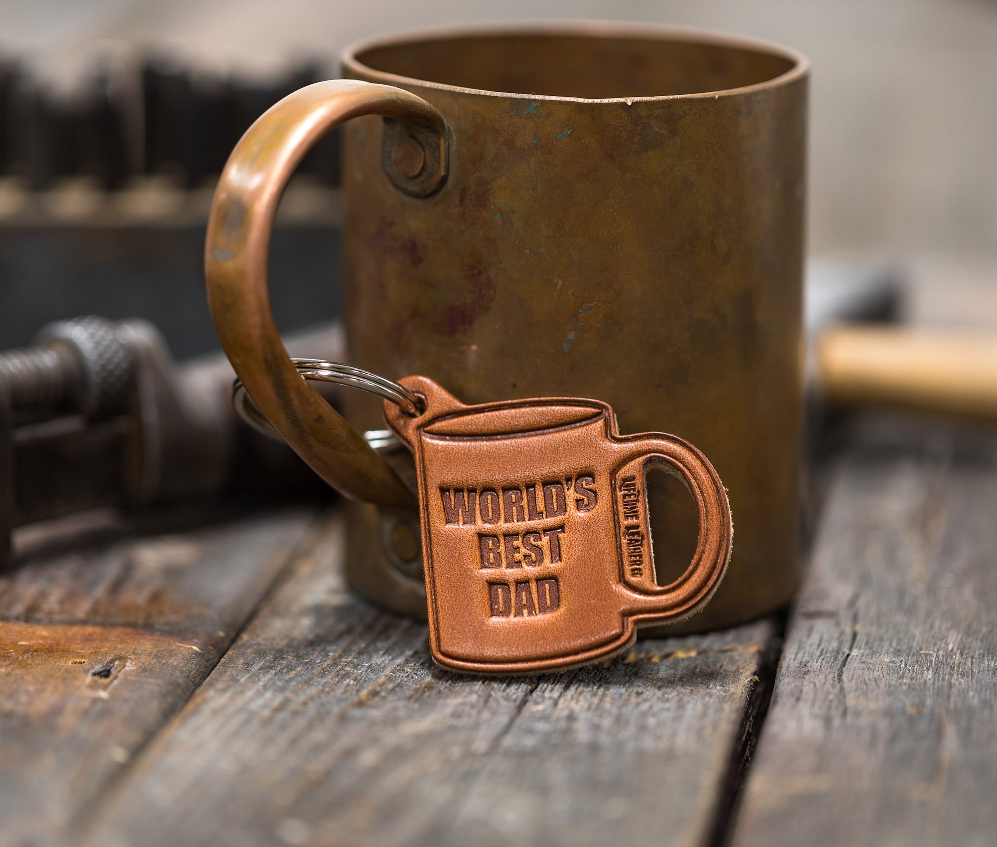 World's Best Dad Leather Keychain made from genuine full grain leather, featuring a heat-stamped design and attached key ring.