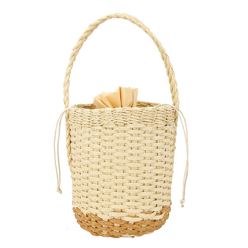 A stylish Young Lady's Leisure Bucket Straw Bag in white and yellow, showcasing its urban simplicity design and single strap.