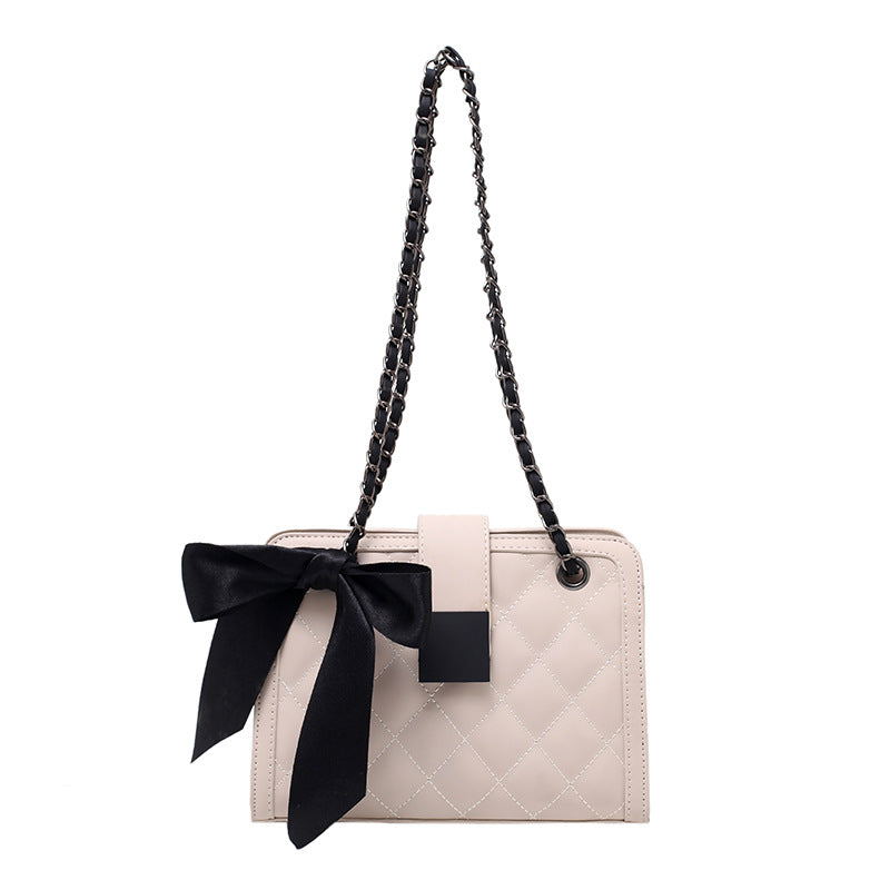 Young Women's One-Shoulder Small Square Messenger Bag in white, black, and coffee colors, showcasing its stylish design and compact size.