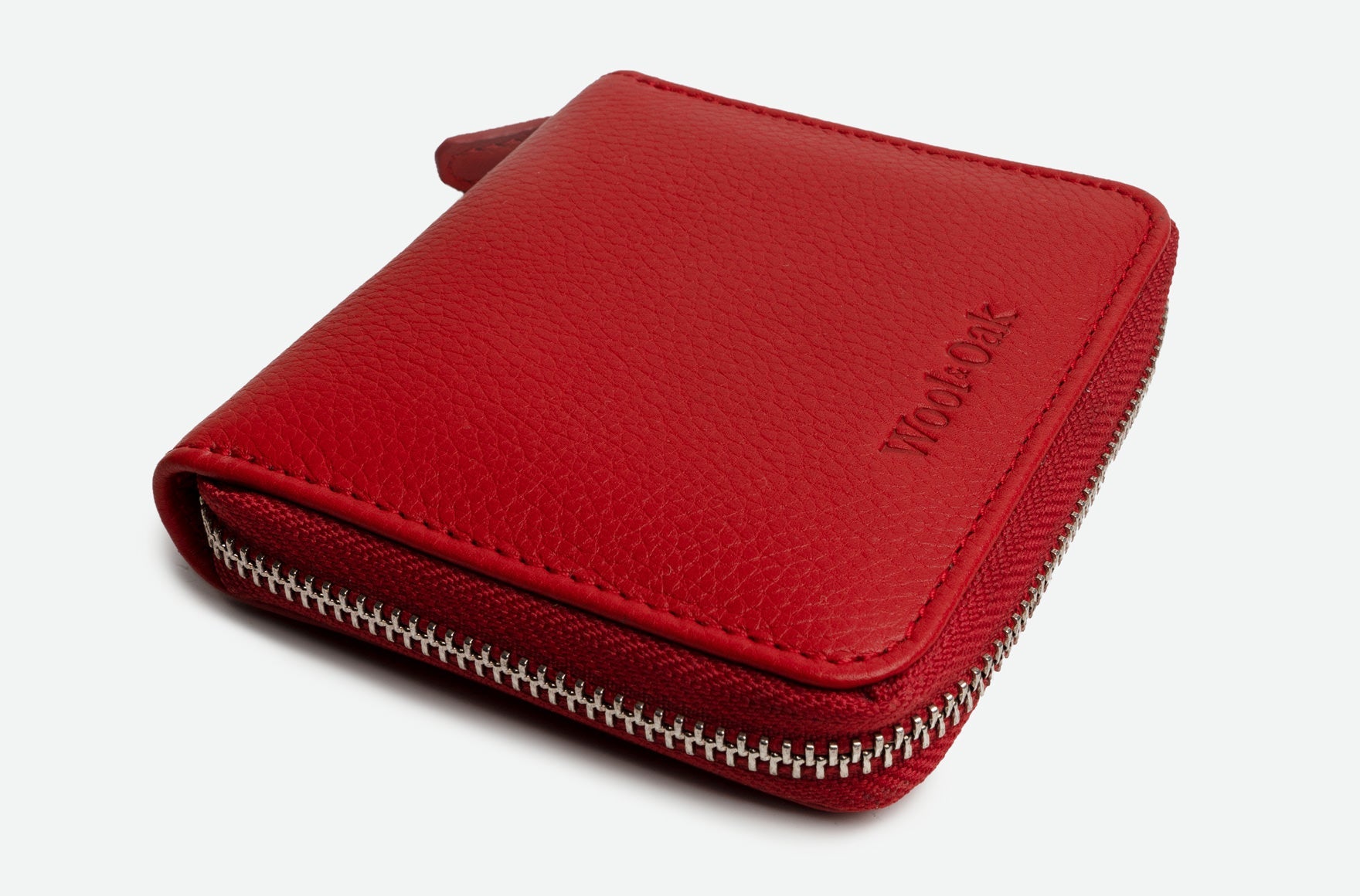 A stylish Zip Around Wallet made of genuine Italian leather, featuring golden YKK zippers and a snapped coin purse.