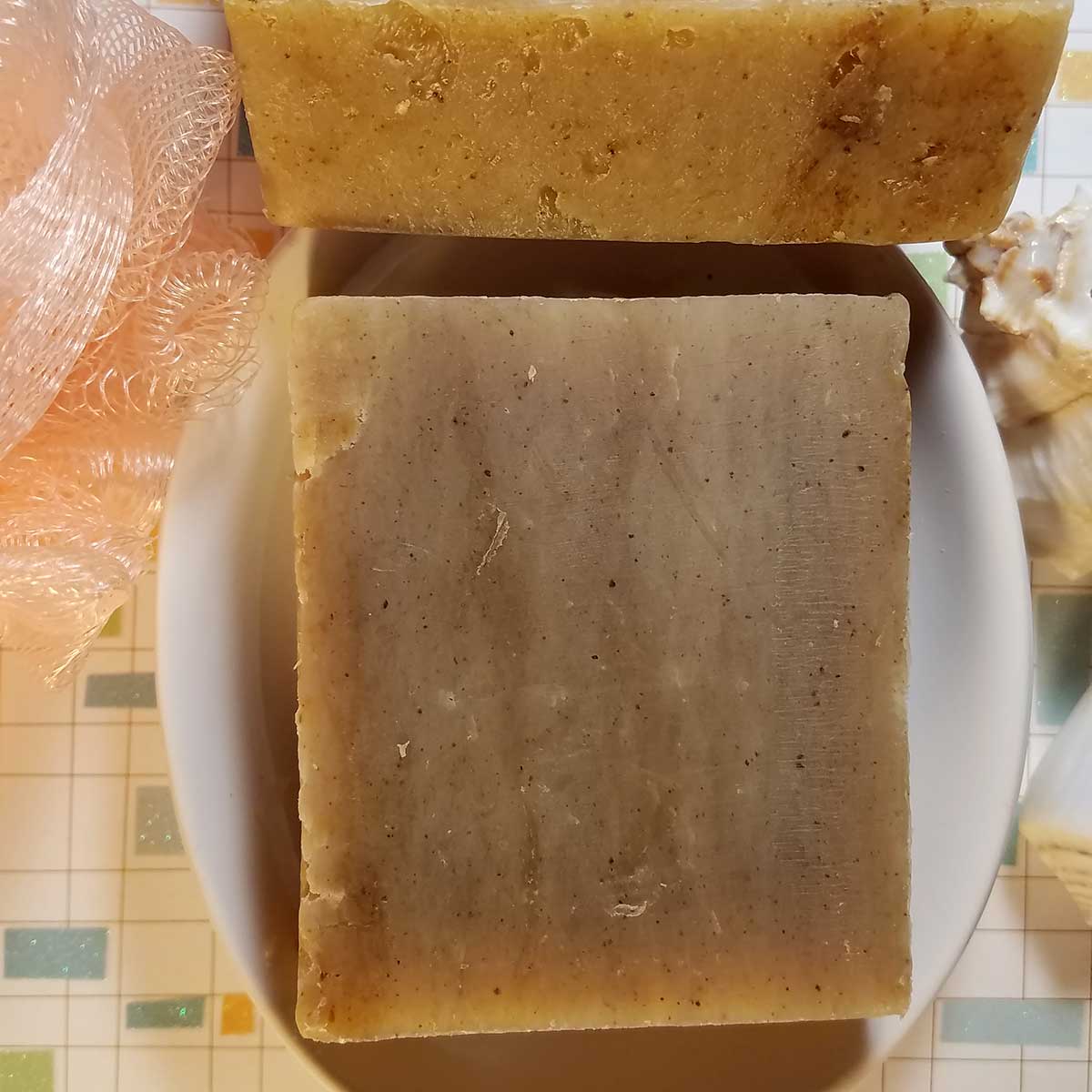 Amber Musk Handmade Soap bar with earthy amber honey and sandalwood scent, featuring natural colors from turmeric and parsley.