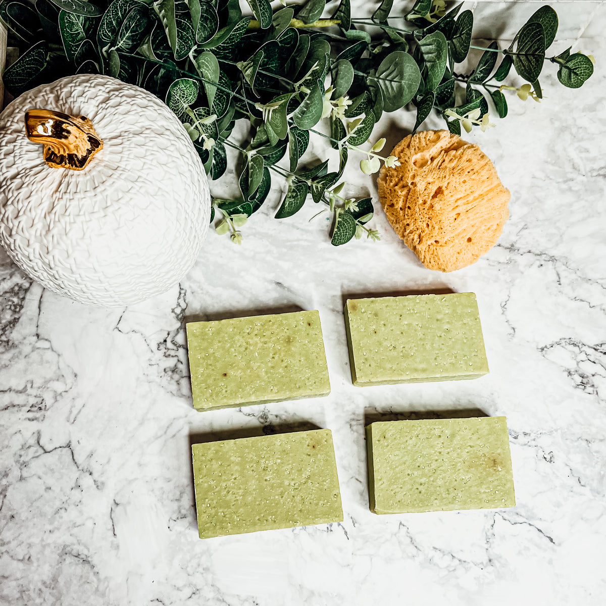 Handcrafted Apple Rose soap bar with floral and apple scent, featuring sea salt and rose petals for exfoliation.