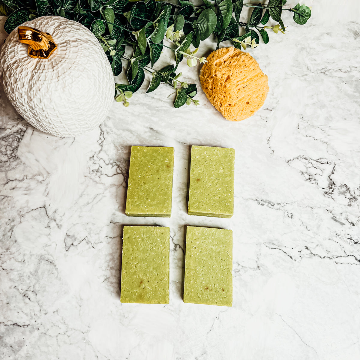 Handcrafted Apple Rose soap bar with floral and apple scent, featuring sea salt and rose petals for exfoliation.