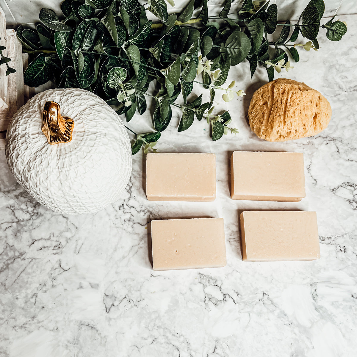 A handcrafted bar of Apple Spice soap featuring a warm blend of sweet red apples, cinnamon, and clove, showcasing its unique design and colors.