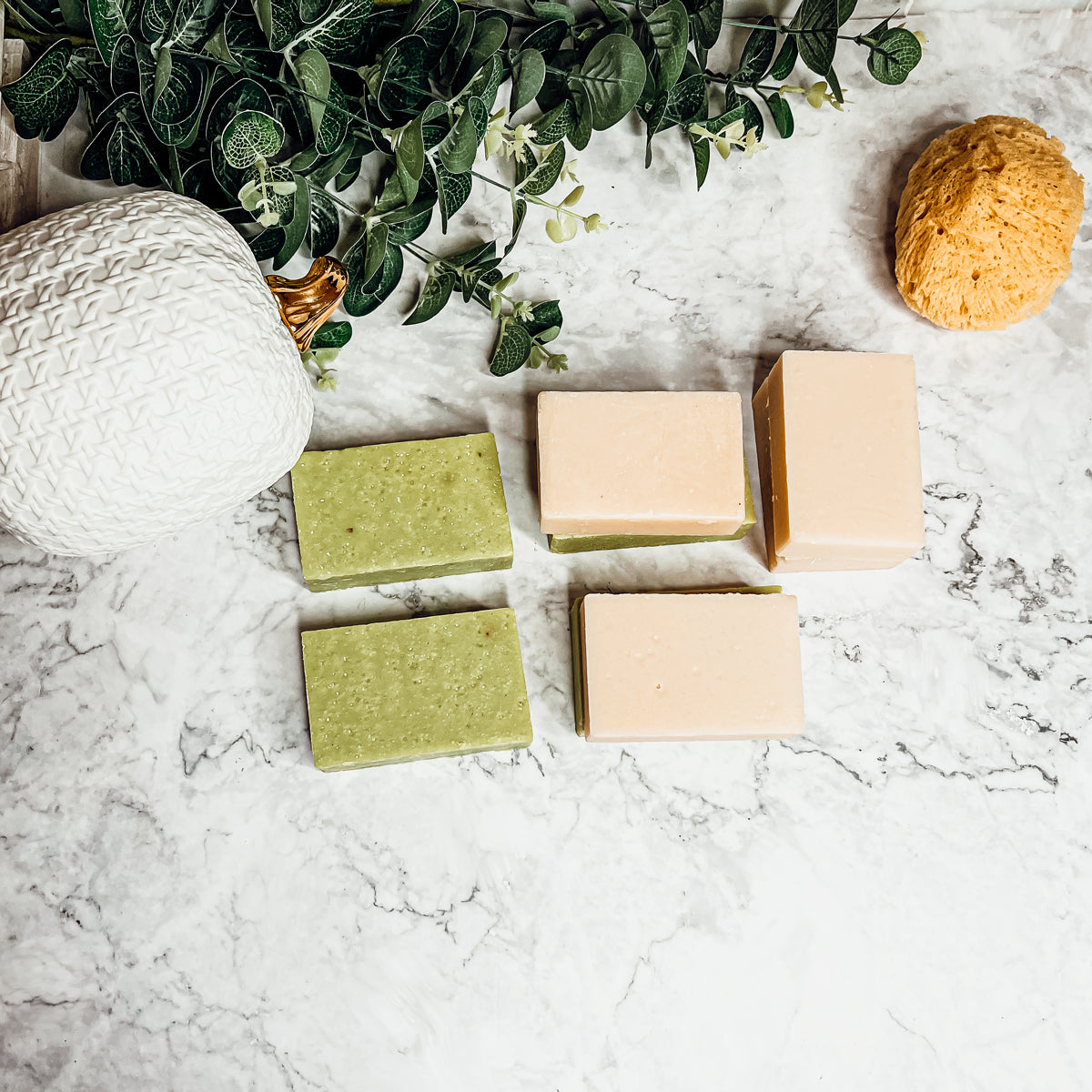 A handcrafted bar of Apple Spice soap featuring a warm blend of sweet red apples, cinnamon, and clove, showcasing its unique design and colors.