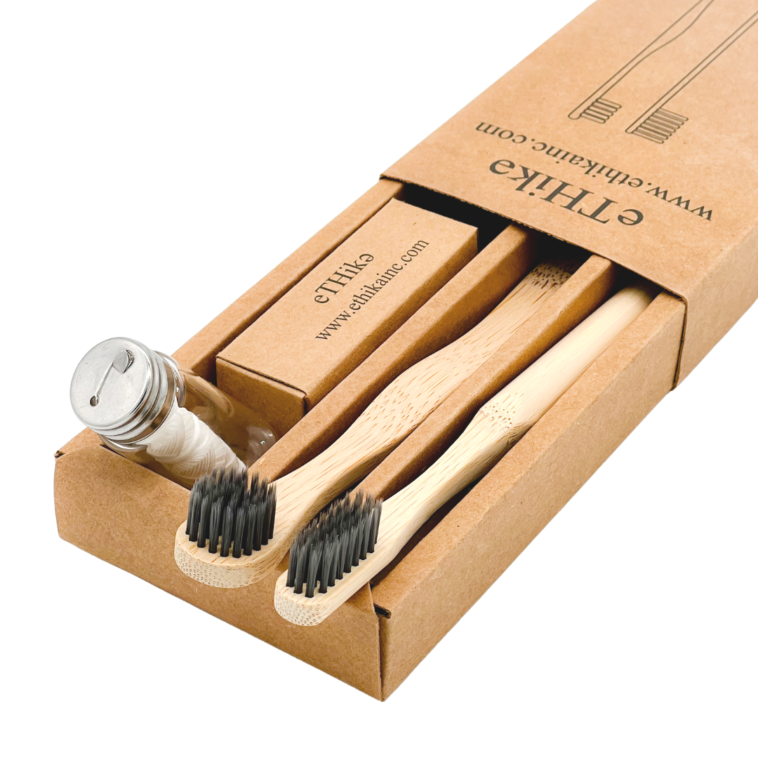 Bamboo Oral Hygiene Care Set including a toothbrush, tongue brush, and mint dental floss in a glass jar, showcasing eco-friendly dental care products.