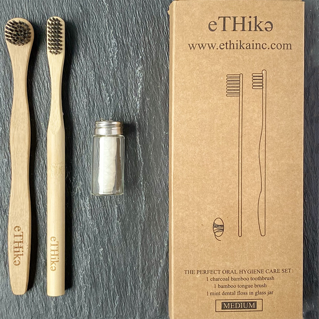 Bamboo Oral Hygiene Care Set including a toothbrush, tongue brush, and mint dental floss in a glass jar, showcasing eco-friendly dental care products.