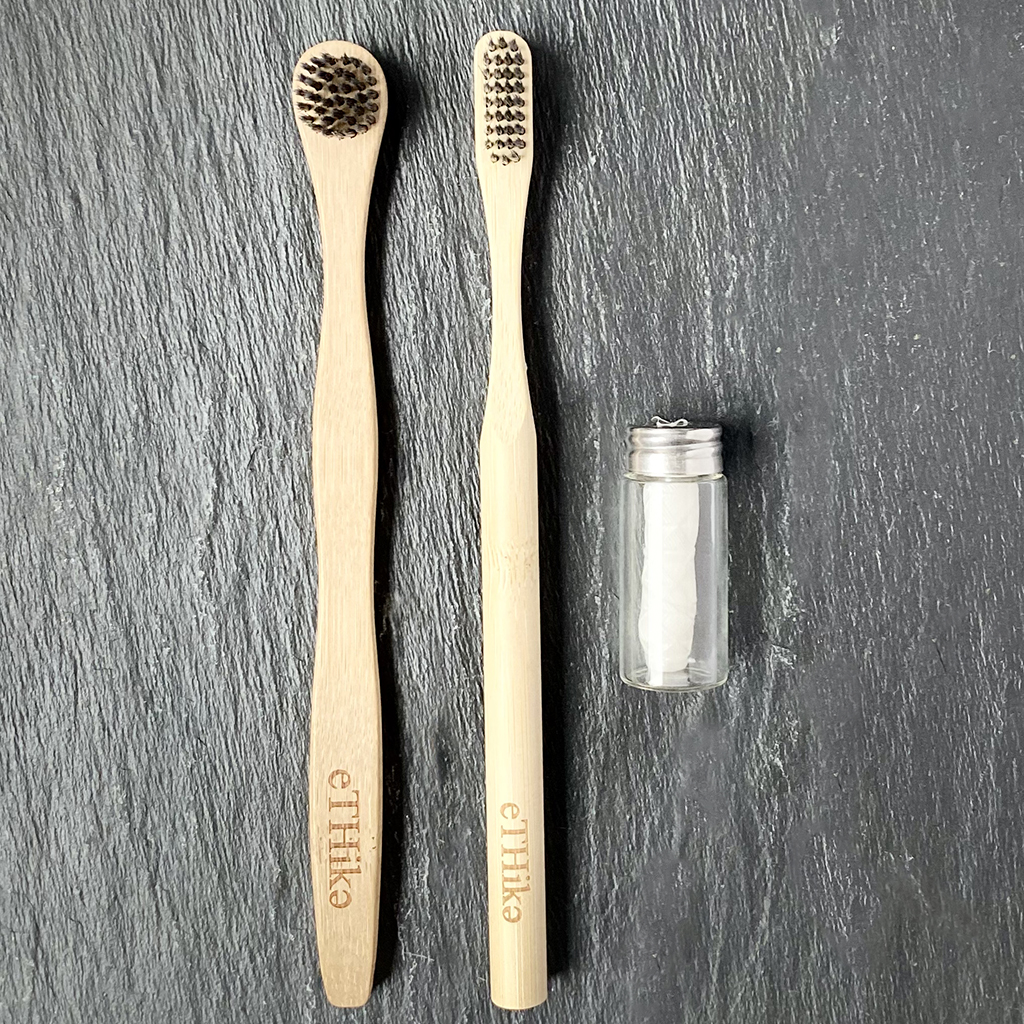 Bamboo Oral Hygiene Care Set including a toothbrush, tongue brush, and mint dental floss in a glass jar, showcasing eco-friendly dental care products.