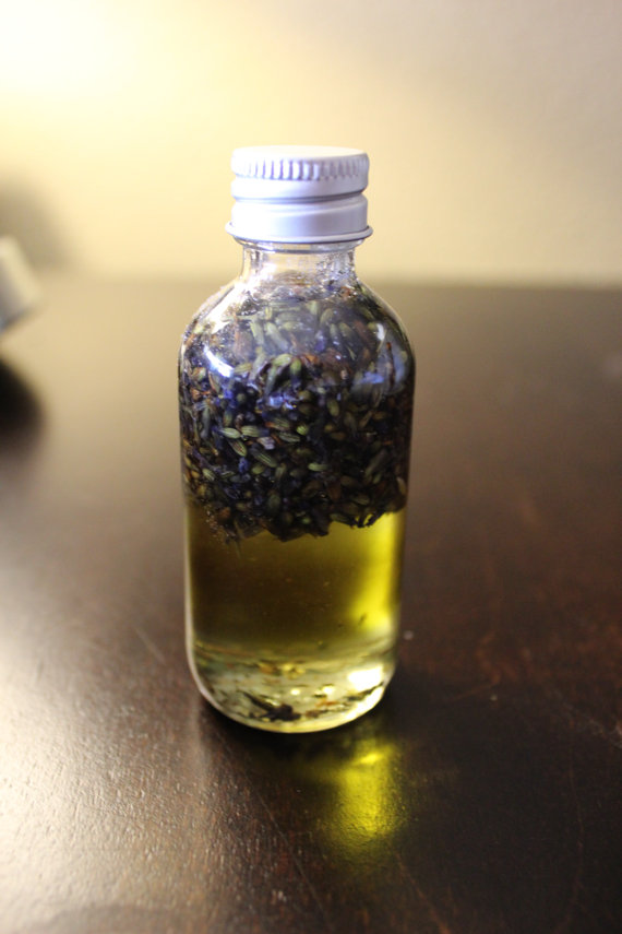 A 2oz bottle of Healing and Relaxing Lavender Bath Oil, featuring organic lavender buds and a blend of nourishing oils, set against a calming background.