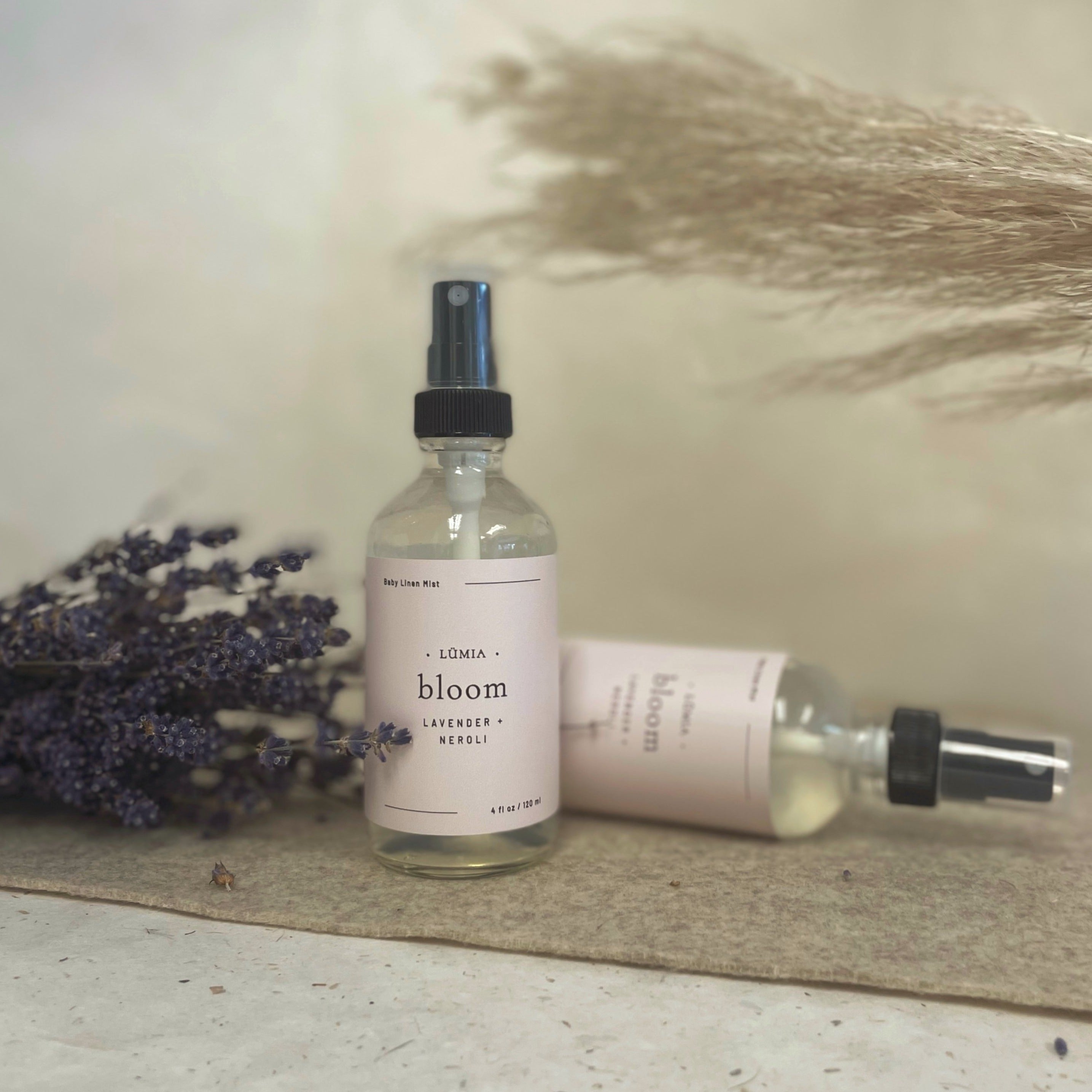 Bloom Botanical Mist bottle with floral hydrosols of Lavender, Chamomile, and Neroli, designed for calming baby linens and rooms.