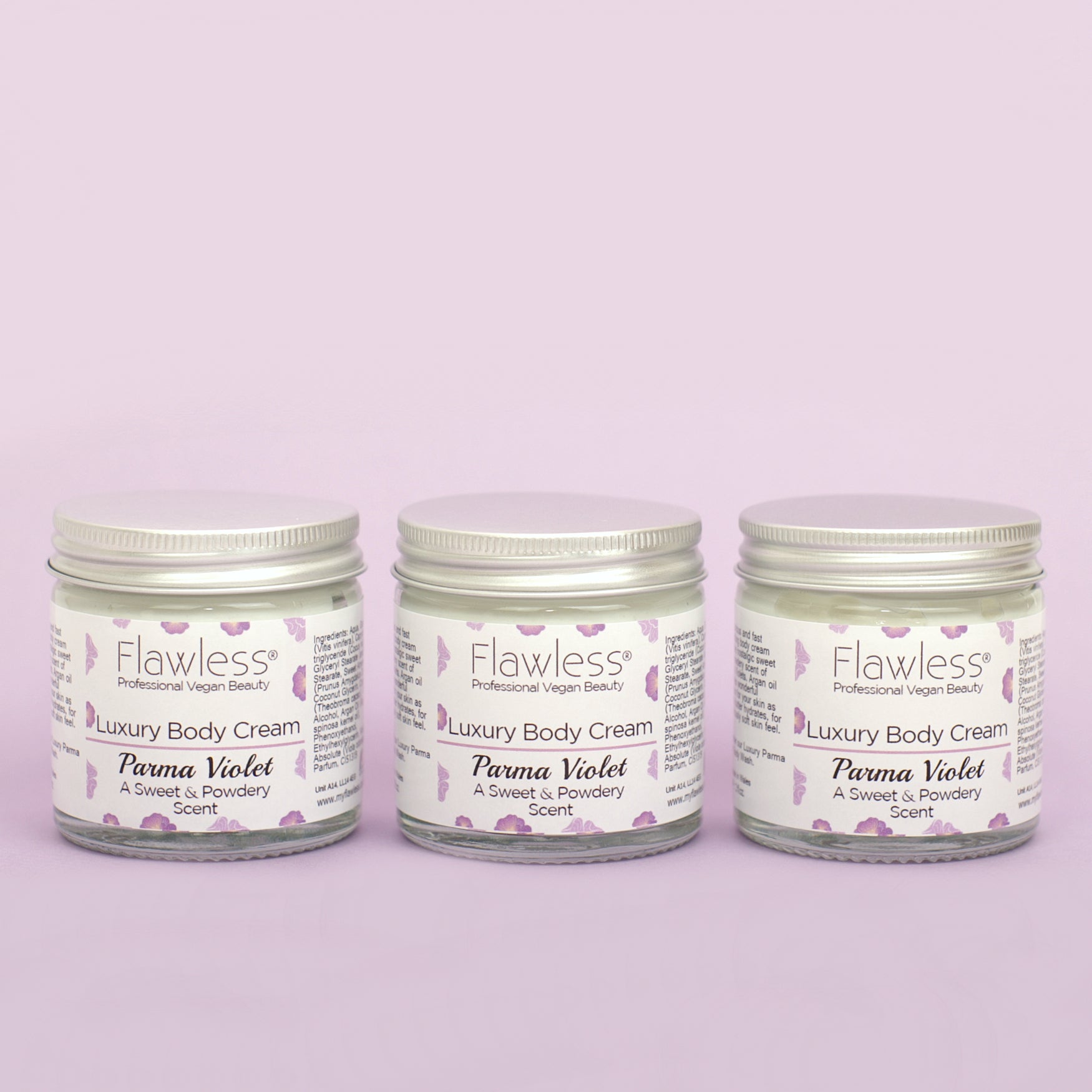 A luxurious jar of Parma Violet Body Cream with a delicate floral design, showcasing its eco-friendly packaging.