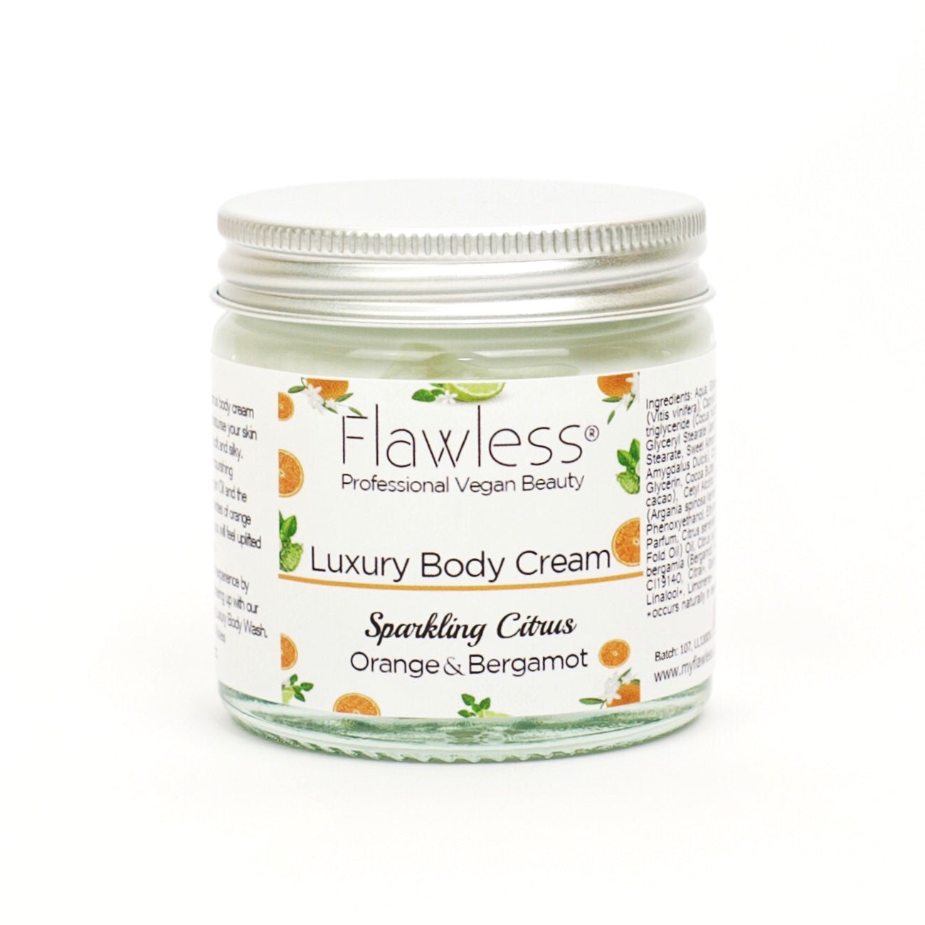 Flawless Sparkling Citrus Body Cream in a recycled glass jar, showcasing its vibrant orange color and eco-friendly packaging.