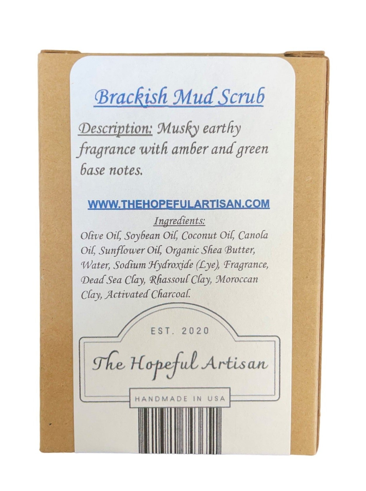 Brackish Mud Scrub in a jar with natural ingredients like charcoal and clays, showcasing its earthy texture and rich color.