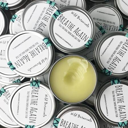 Breathe Again Tin featuring a natural blend of essential oils in a compact, portable container.