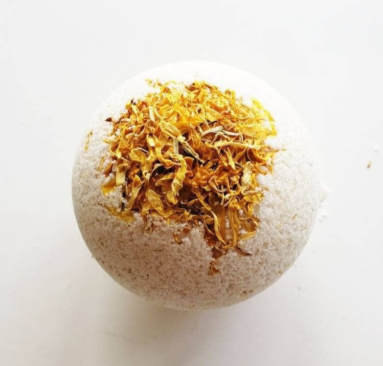 A vibrant Calendula Big Bath Bomb, showcasing its colorful design and natural ingredients, perfect for a relaxing bath experience.