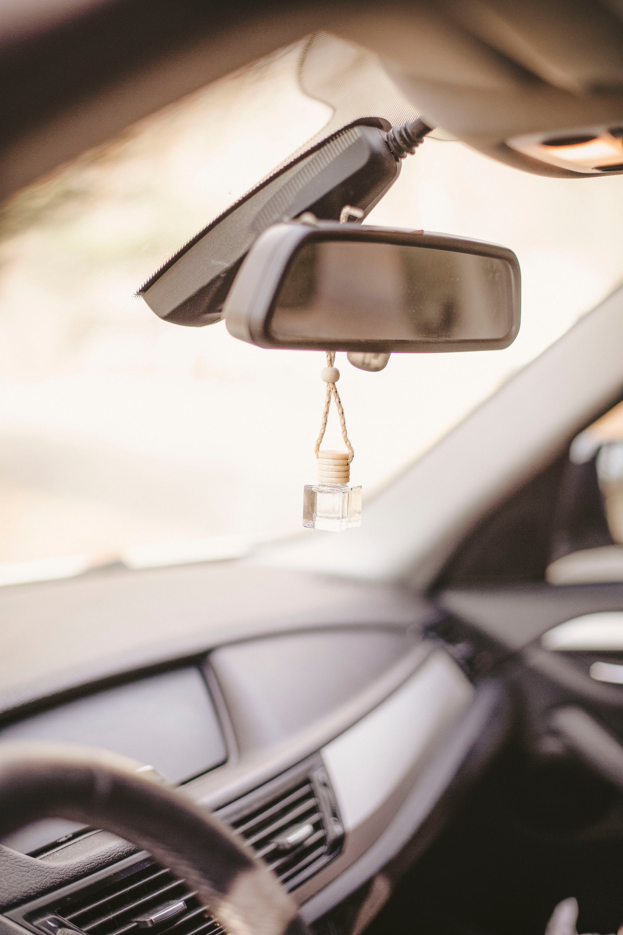 A stylish hanging car diffuser filled with 8ml of unique fragrance blends, designed to enhance the car's interior aroma.