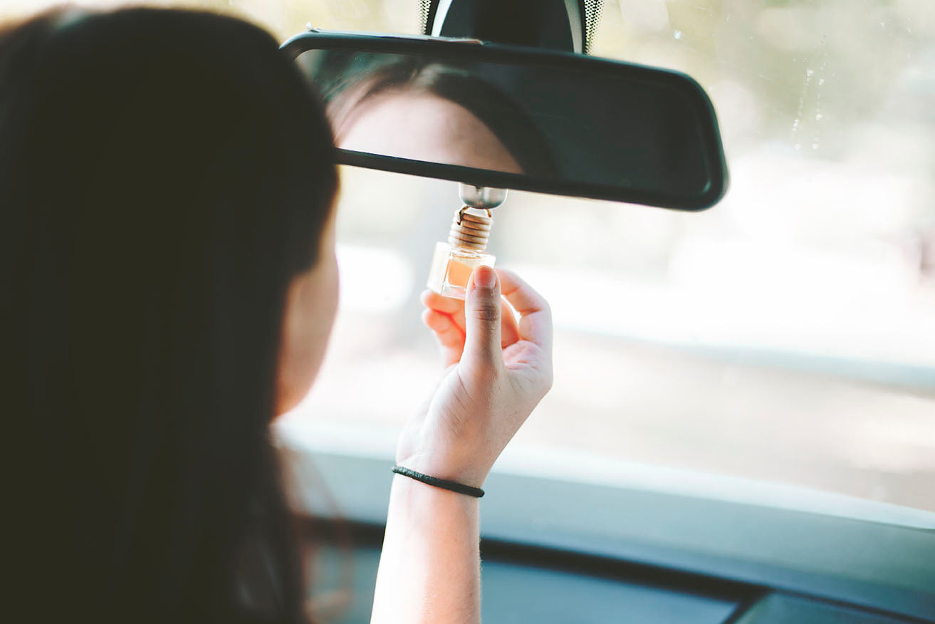 A stylish hanging car diffuser filled with 8ml of unique fragrance blends, designed to enhance the car's interior aroma.