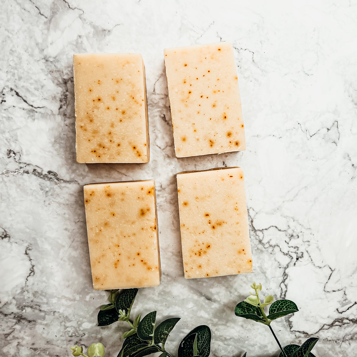 Carrot-Olive-Sunflower-Citrus soap bar with vibrant colors and unique design, showcasing its handcrafted quality and natural ingredients.