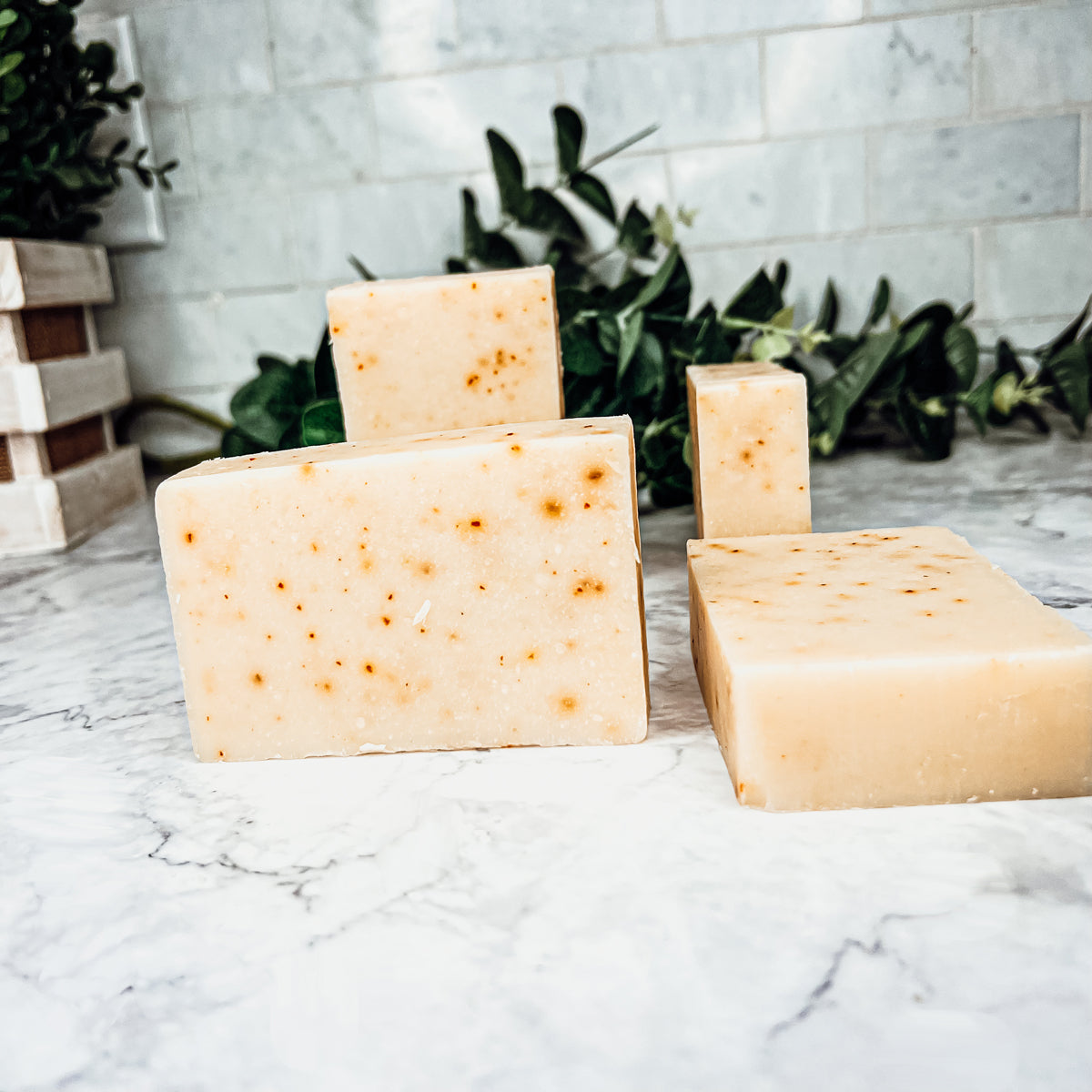 Carrot-Olive-Sunflower-Citrus soap bar with vibrant colors and unique design, showcasing its handcrafted quality and natural ingredients.