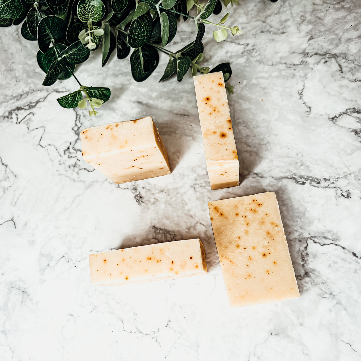 Carrot-Olive-Sunflower-Citrus soap bar with vibrant colors and unique design, showcasing its handcrafted quality and natural ingredients.