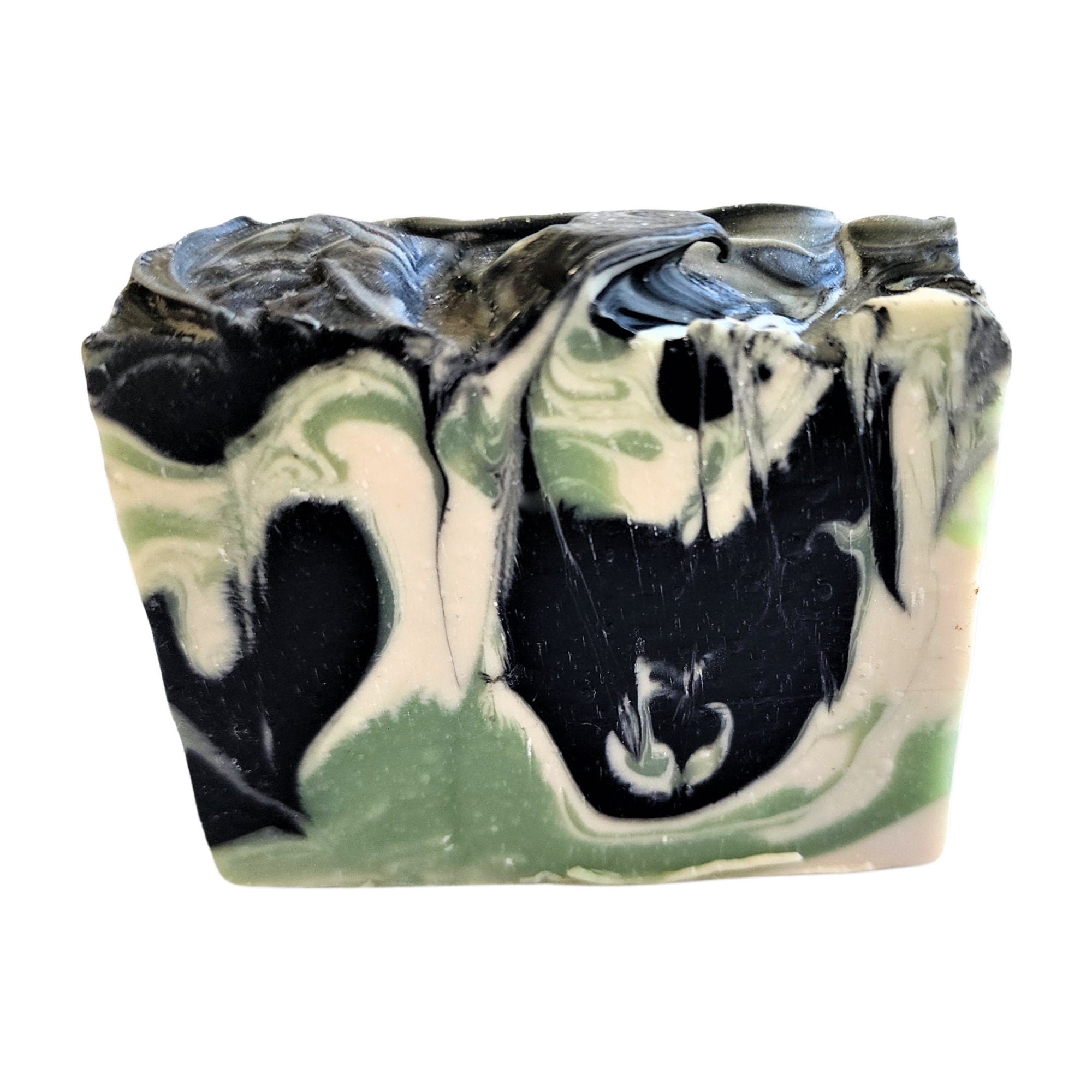 Charcoal Mint Soap with seafoam green and white sand swirls, showcasing its unique design and texture.