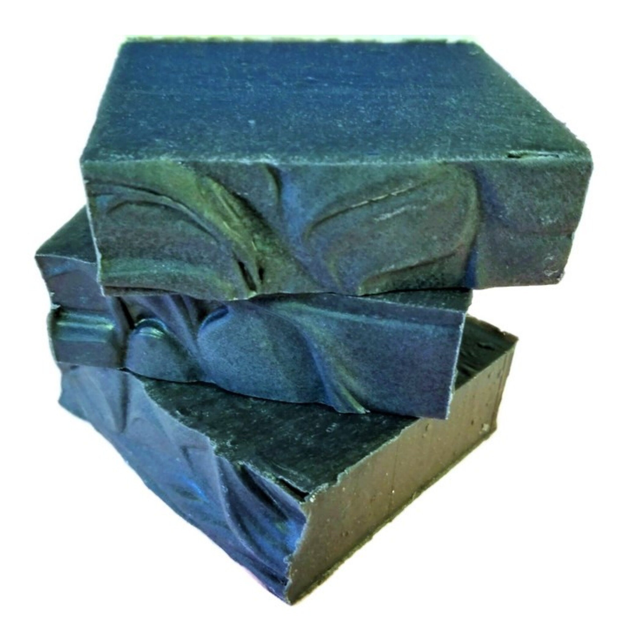 A sleek and rich Charcoal Tea Tree Soap bar, showcasing its dark color and natural ingredients, perfect for deep cleansing.