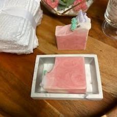 Cherry Bloom soap with swirled design and flower icing, showcasing its vibrant colors and handcrafted quality.