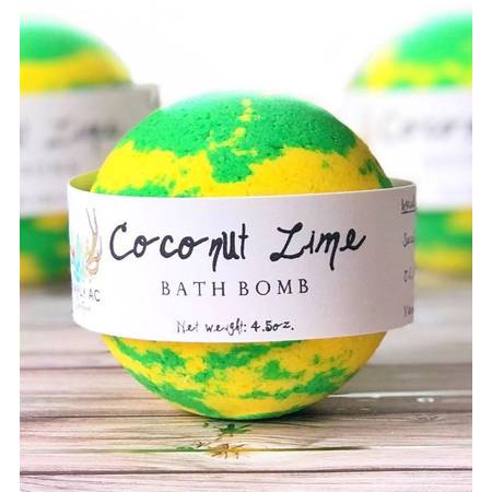 A vibrant Coconut Lime Bath Bomb with tropical colors, showcasing its fizzing texture and inviting scent.