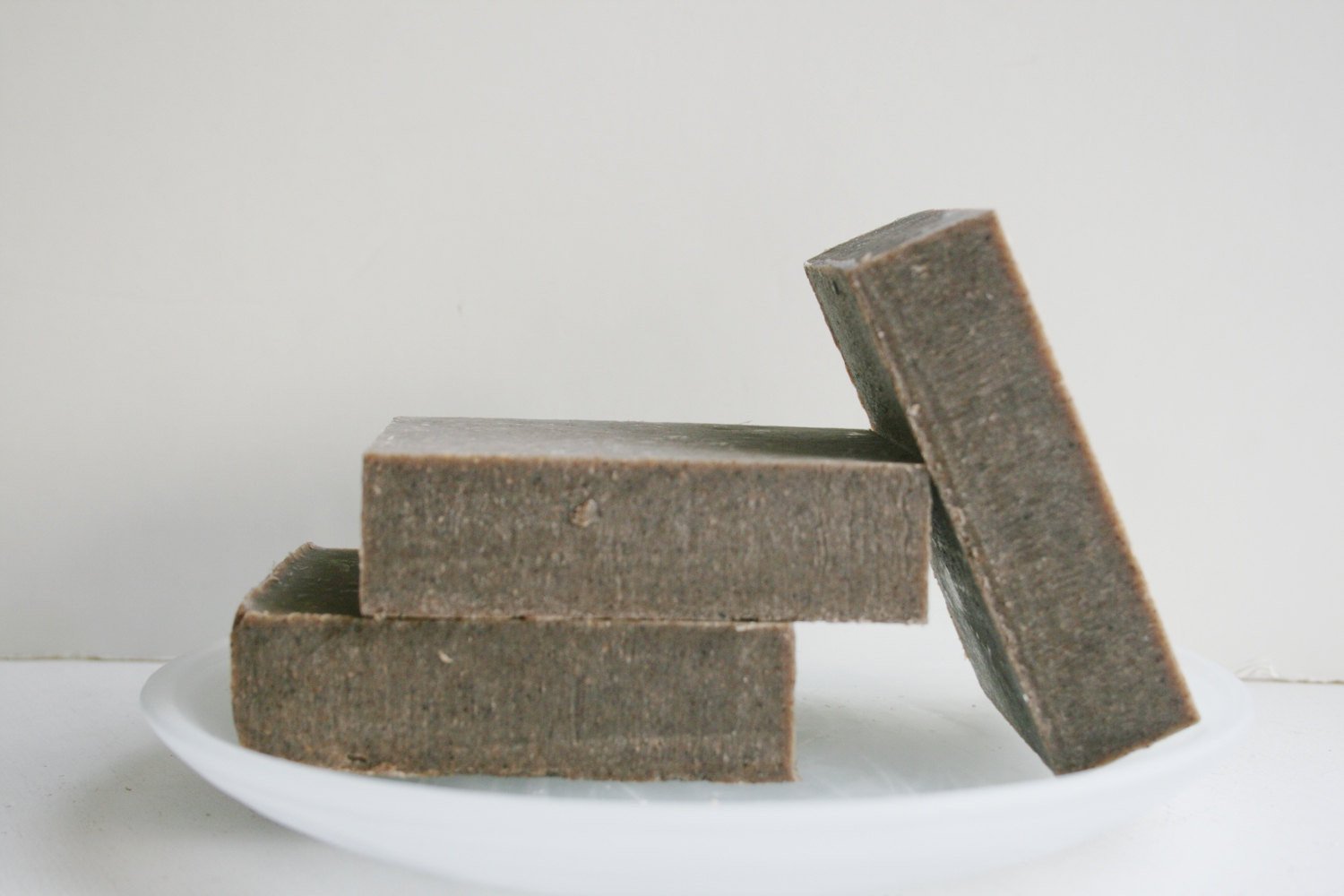 A bar of Comfrey & Aloe Soap showcasing its natural ingredients, with a smooth texture and earthy tones, ideal for gentle skin care.