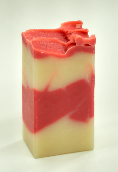 A bar of Country Apple Soap with a complex scent of apples, pineapple, and vanilla, showcasing its handcrafted quality.