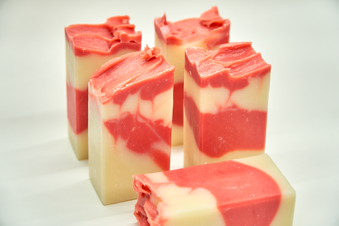 A bar of Country Apple Soap with a complex scent of apples, pineapple, and vanilla, showcasing its handcrafted quality.